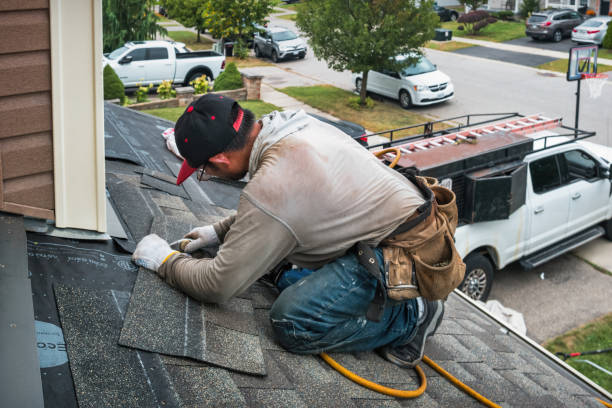 Professional Roofing technician working in Hollandale, WI